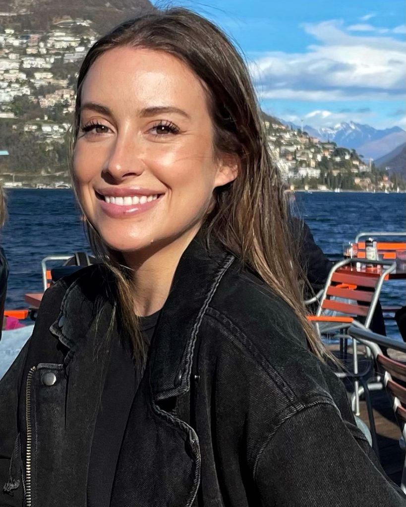Caitlin Traasc's headshot dressed in a black jacket.