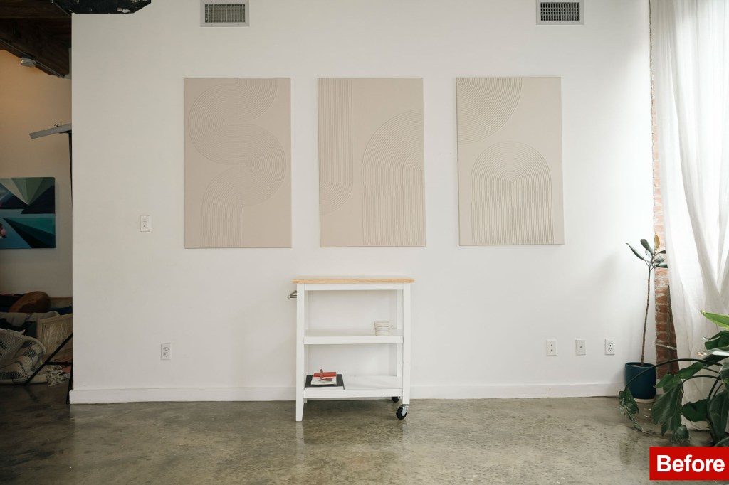 In front of the photo of a living room of apartments in Brooklyn